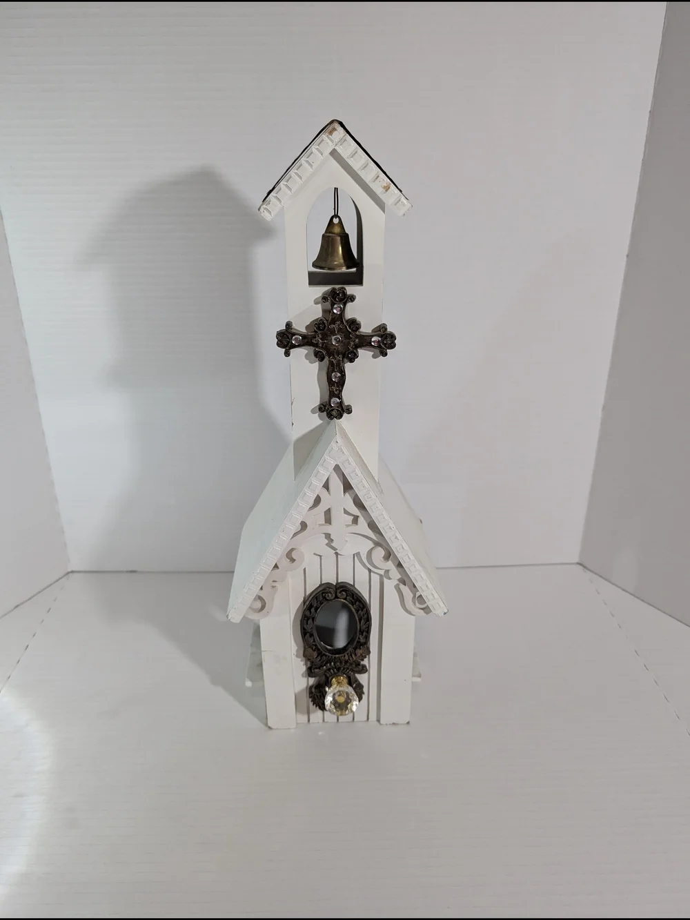 White Decorative Church Wall Accent with Bronze Cross and Bell